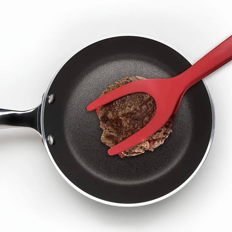 HighPeak FlipGrip™ 2 in 1 red spatula tongs gripping a burger patty in a non-stick frying pan.
