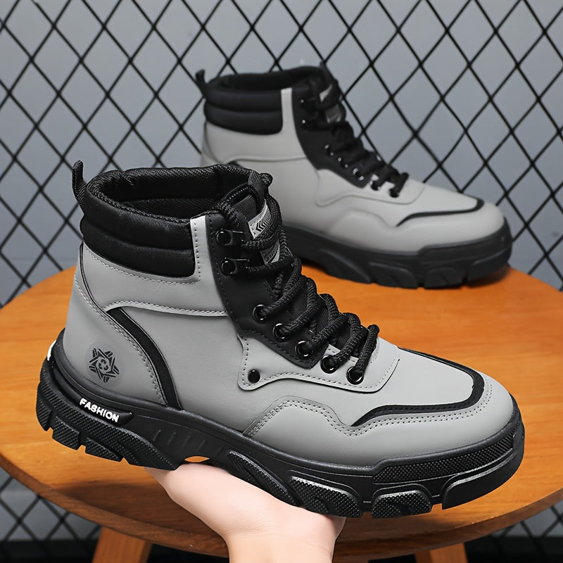 TrailForge⢠Boots in gray and black with thick EVA sole and lace-up fit held in hand against a metal mesh background by HighPeak