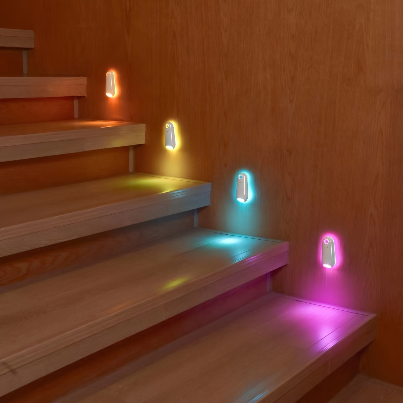 GlowStep Motion Sensor Lights mounted on wooden stairs, displaying orange, yellow, blue, and pink illumination with soft glow effect