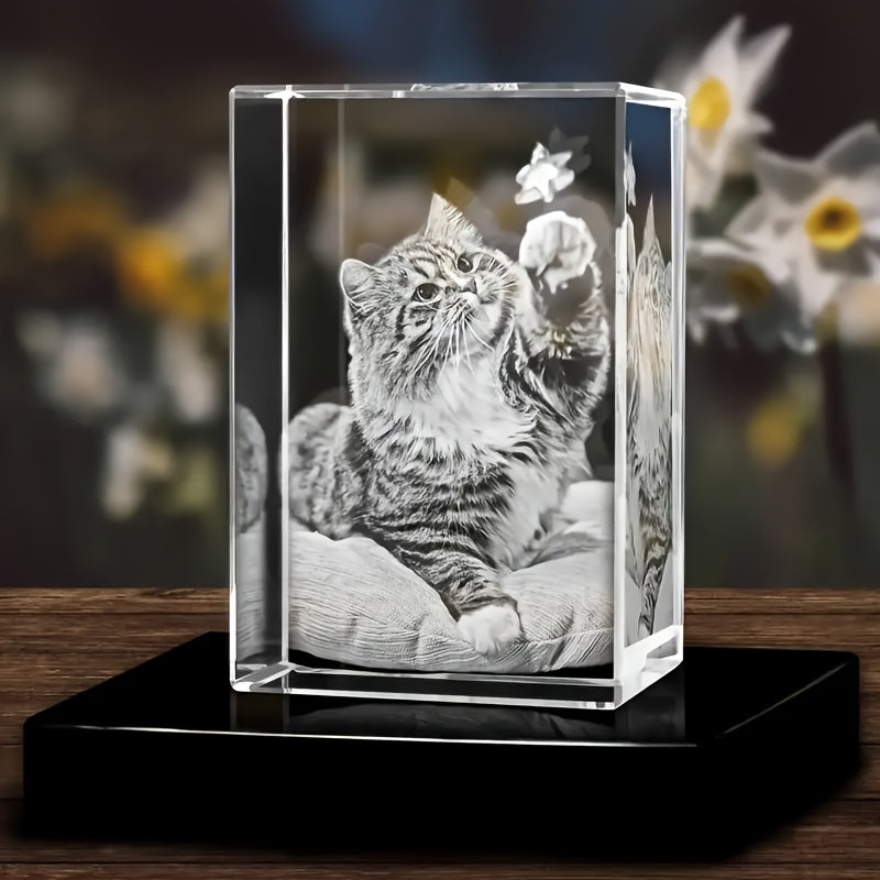 HighPeak EternaCrystal 3D laser-engraved crystal pet memorial displaying playful cat on cushion, with black base display stand