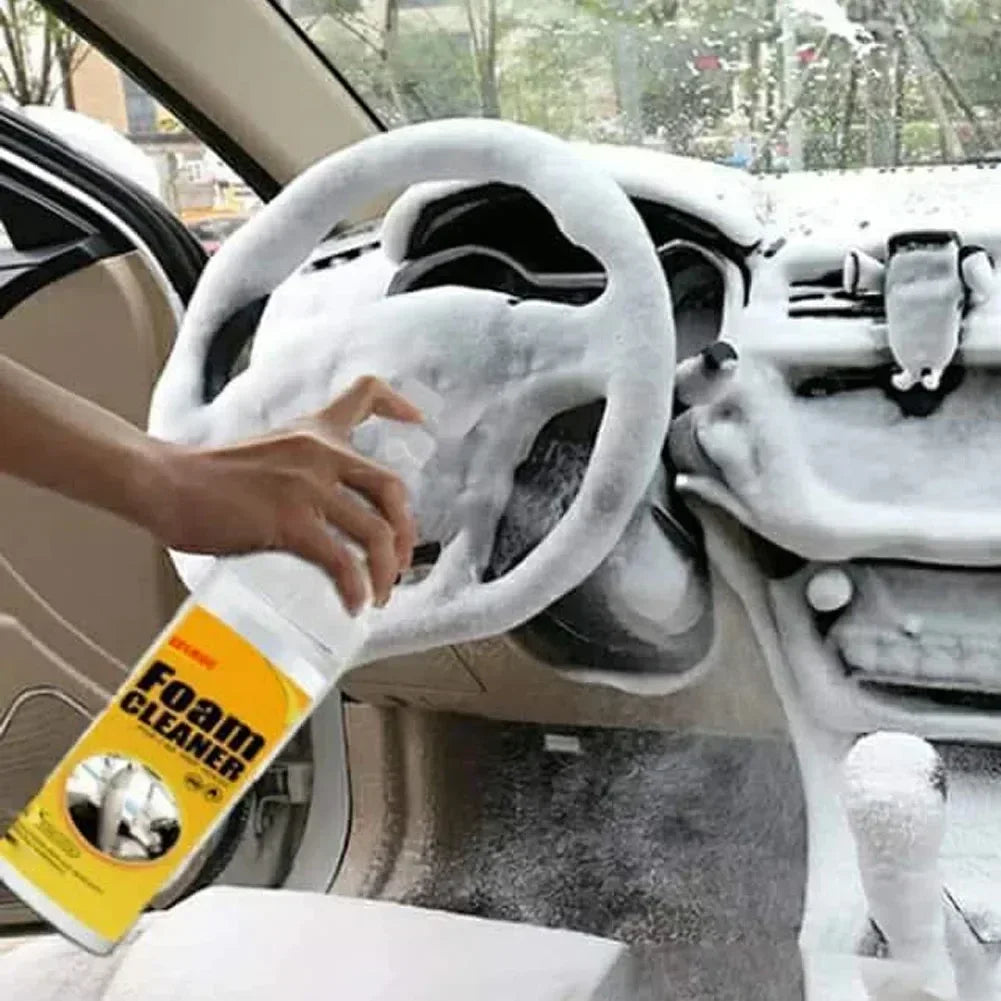 HighPeak FoamBlitz Cleaner foaming thick on a car steering wheel and dashboard for deep multi-surface cleaning