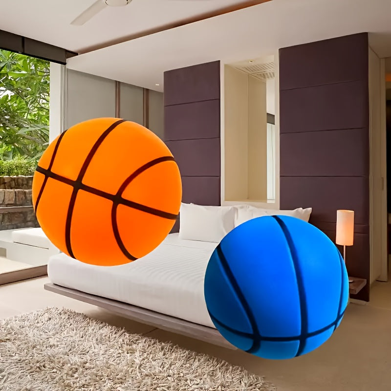 Silent Basketball in orange and blue displayed on white bed - noise-free indoor sports equipment for quiet practice