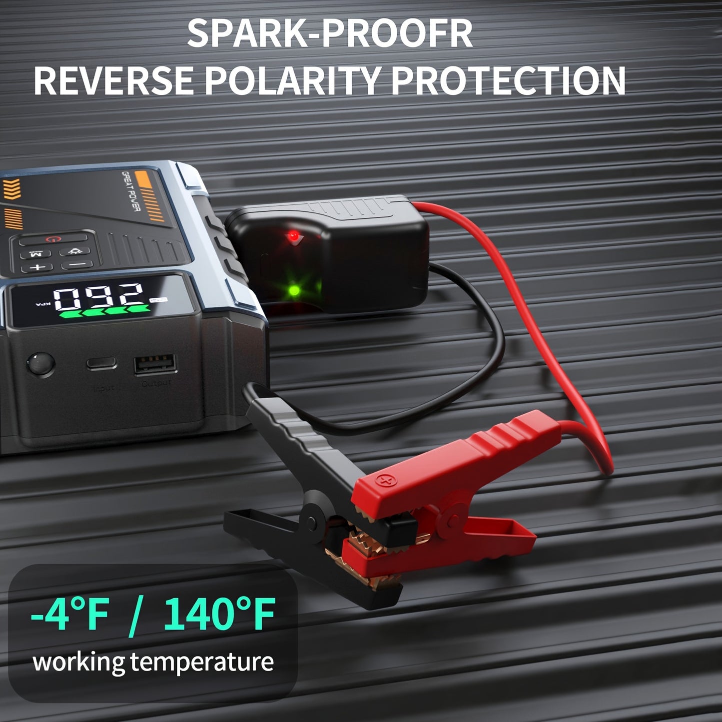 RoadRevive™ jump starter in black with red clamps showing spark-proof and reverse polarity protection features on a textured surface