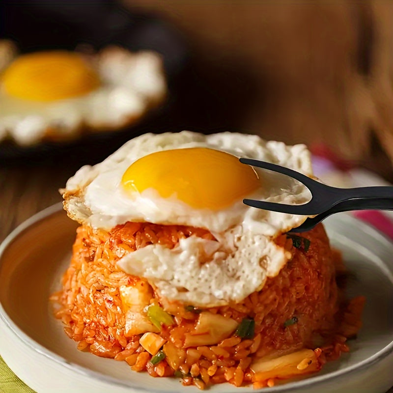 FlipGrip™ 2 in 1 Spatula Tongs gripping a fried egg atop seasoned rice, showcasing precision and control in the kitchen