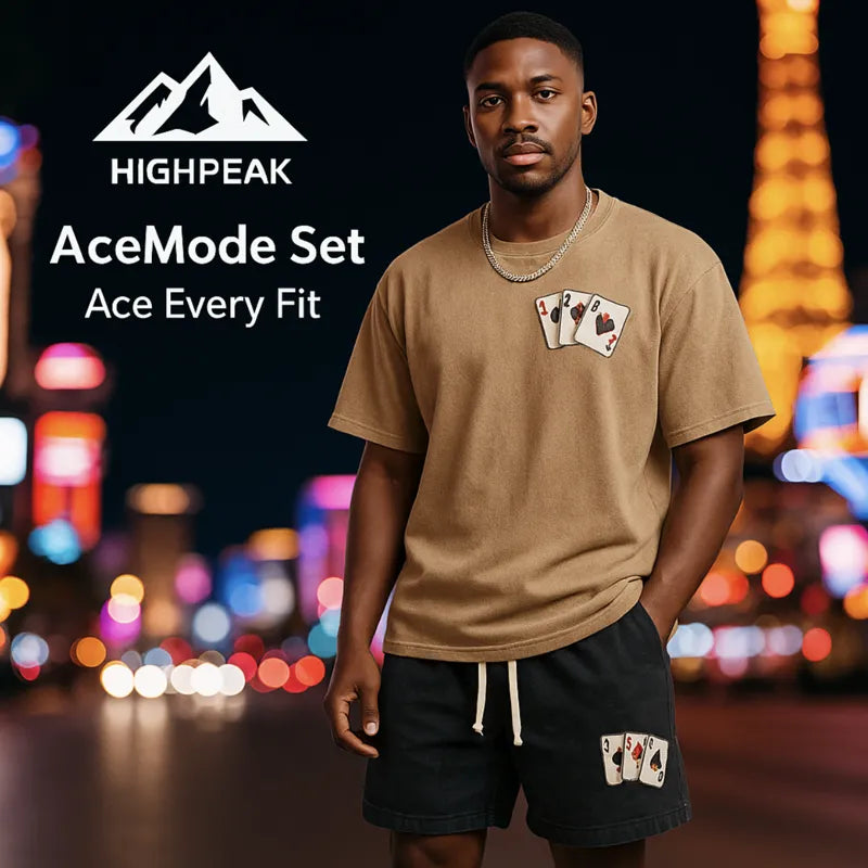 HighPeak AceMode Set with tan graphic tee and black shorts featuring card patch detail in urban night setting
