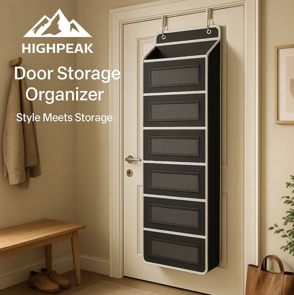 HighPeak Over The Door Storage Organizer in black with 5 deep pockets hanging on a white door in entryway.