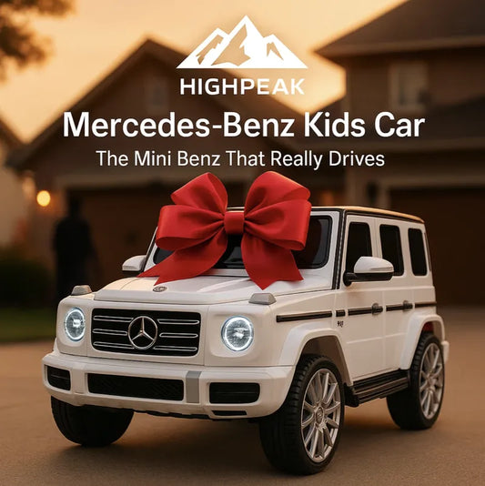 HighPeak Driveable Mercedes-Benz Car in white with headlights on and a red bow outside a suburban home at dusk