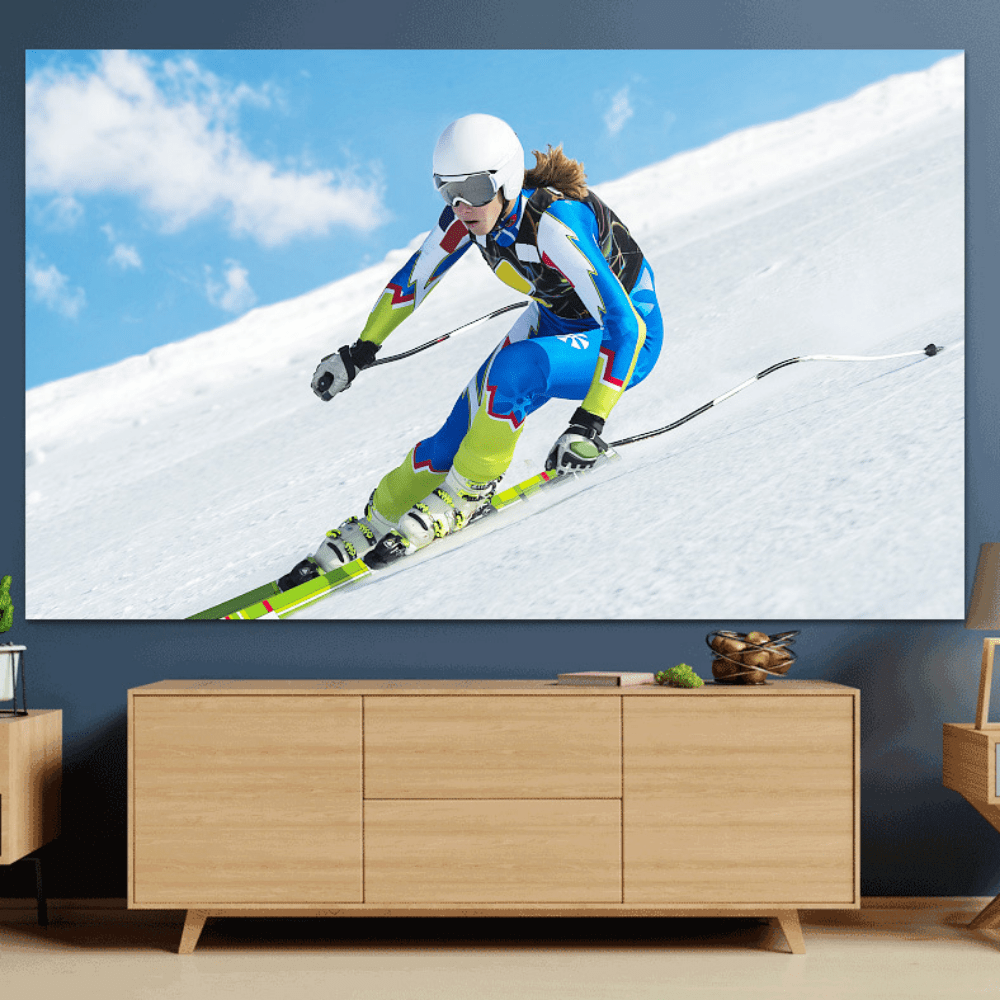 HighPeak ClarityBoost Projector Screen mounted on wall displaying vivid skiing scene in modern living room setup