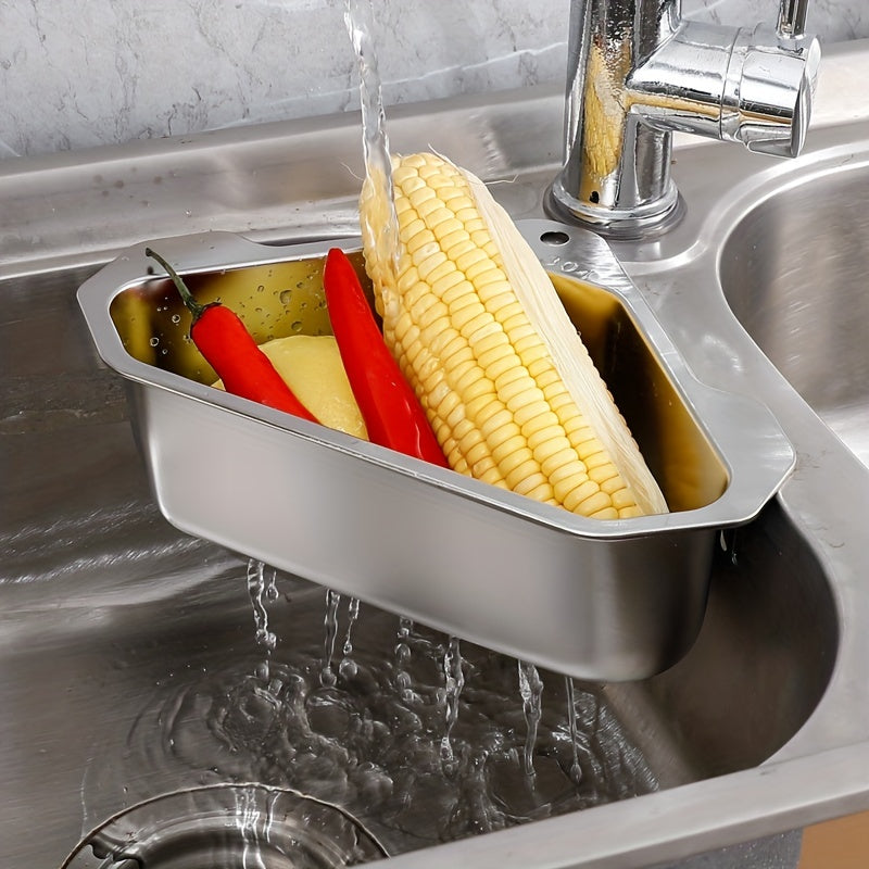 HighPeak SinkMate™ - Corner Strainer Basket in stainless steel holding vegetables under running water in a kitchen sink corner