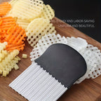 WaveBlade™ – Crinkle Cutter Knife with black handle slicing wavy fries on wooden board, HighPeak kitchen tool