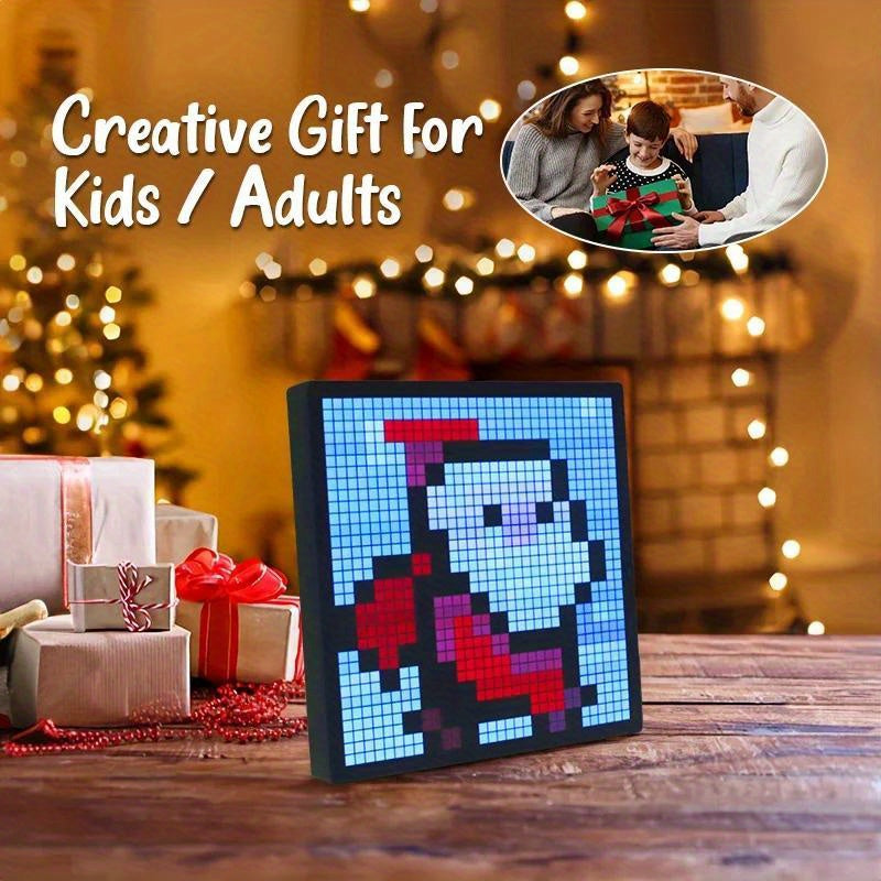 PixelPlay™ Smart LED Frame displaying pixel art Santa on wood table with holiday gifts and blurred lights background
