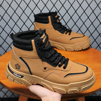TrailForge™ boots in tan and black with thick EVA sole and lace-up fit showcased on wooden table by HighPeak