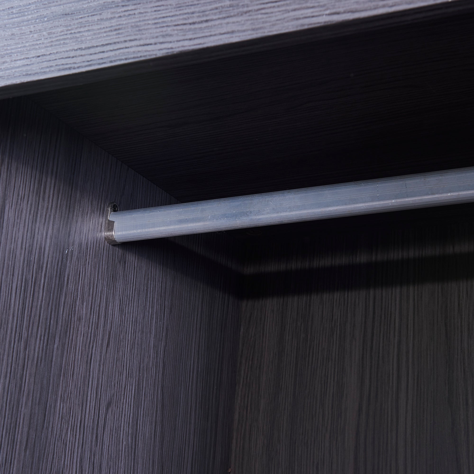HighPeak Foldable Cabinet Bed wardrobe close-up showing sleek gray wood grain and metal hanging rod interior detail