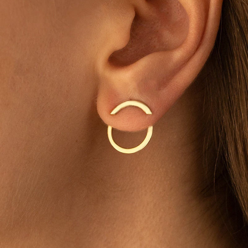 HighPeak Geometric Gold Earrings in gold-plated copper worn on ear showcasing minimalist circle and arc design.