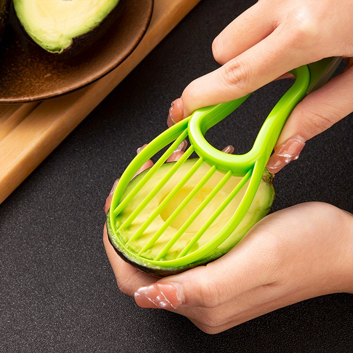 HighPeak Avocado Slicer in bright green slicing avocado flesh with comfortable grip for mess-free prep.