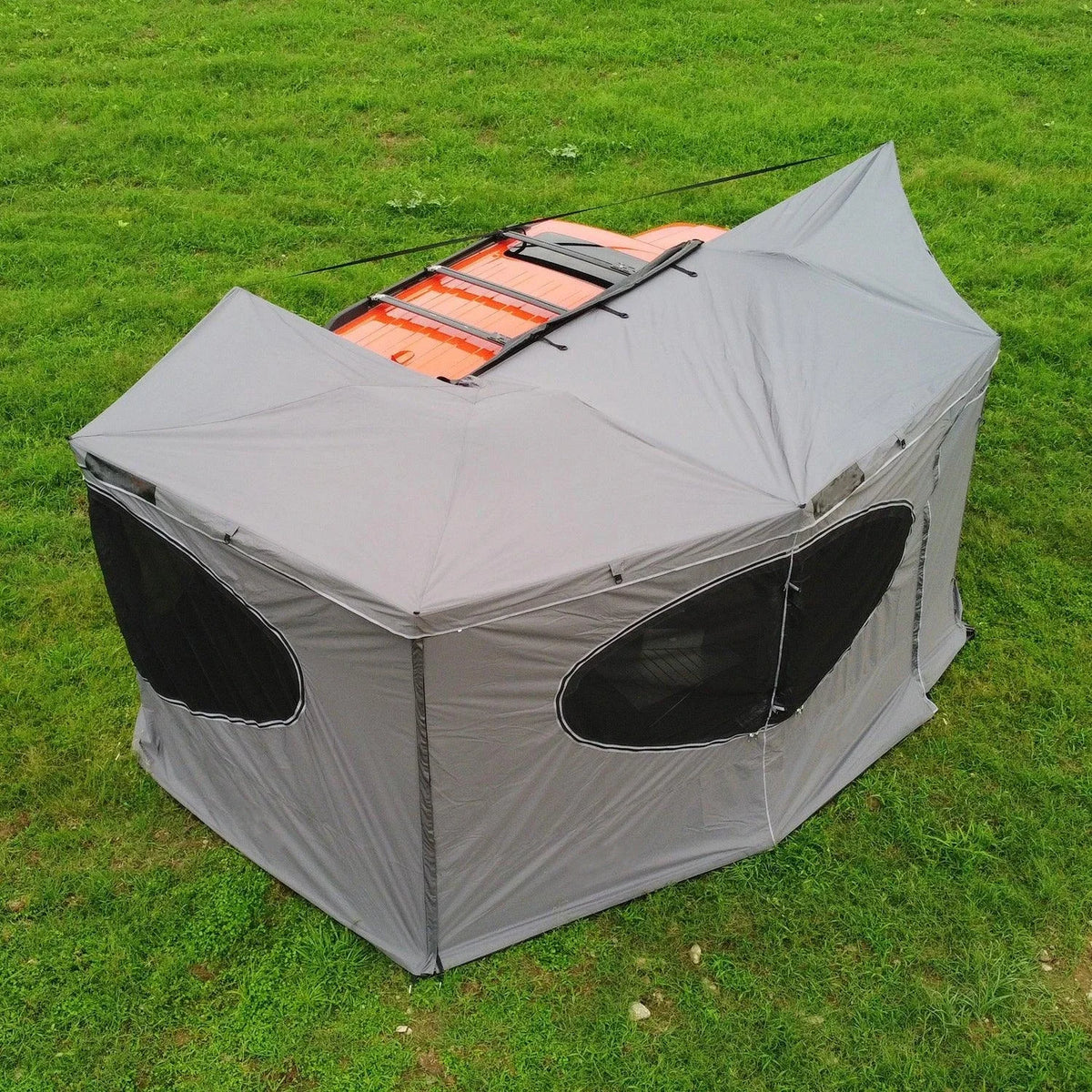 270° Vehicle Awning Tent in gray, shown from above with enclosed walls around an orange vehicle.
