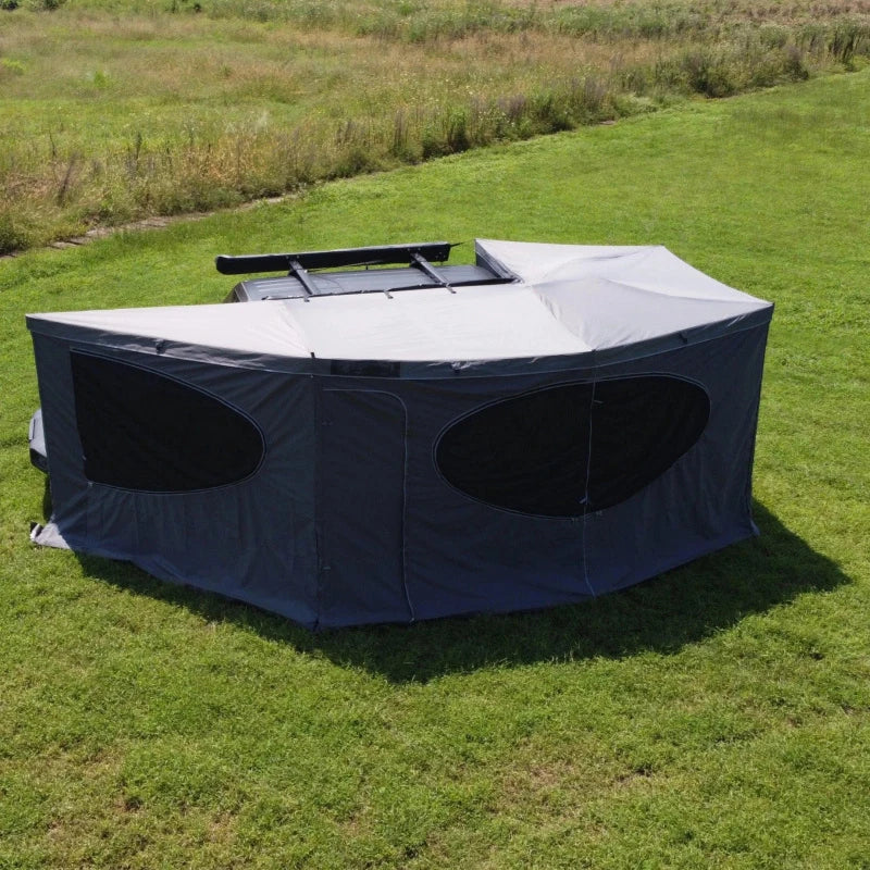 270° Vehicle Awning Tent broad side view with enclosed walls, two windows and a central entrance.