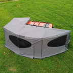 270° Vehicle Awning Tent side view showing gray wall panels, dark windows and wraparound canopy.