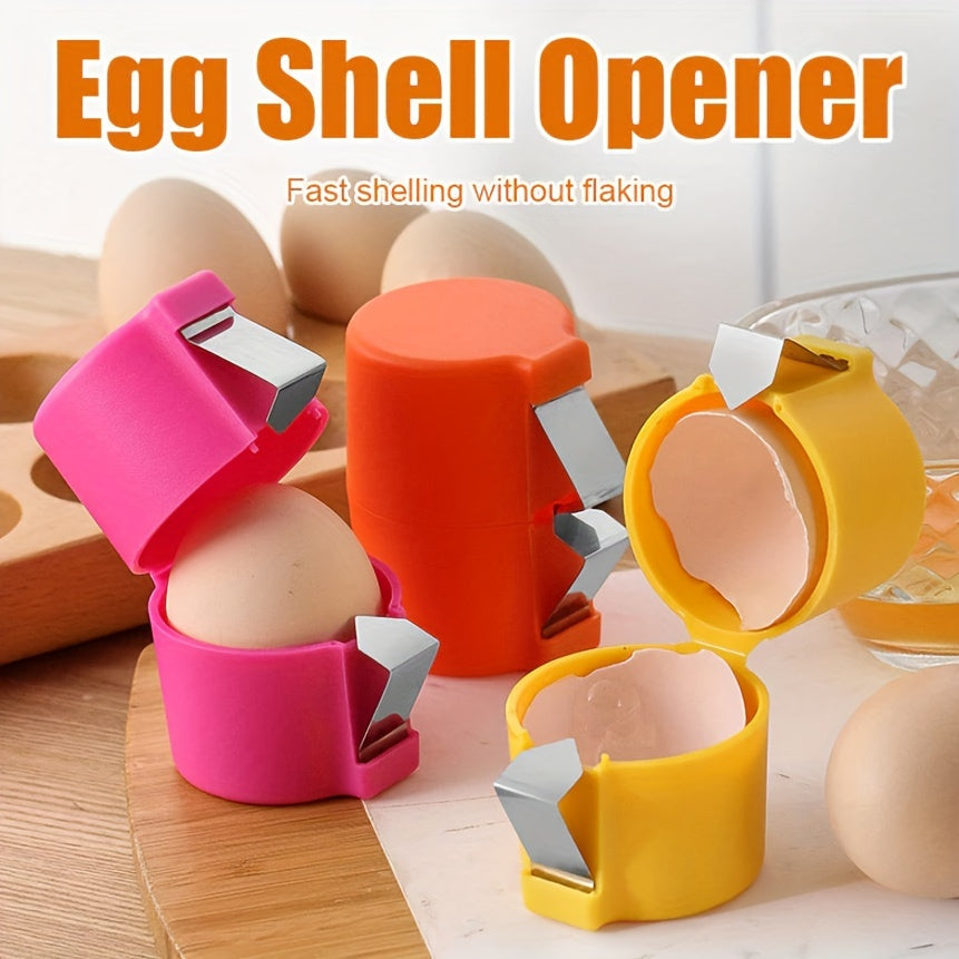 CrackMate™ - Eggshell Separator in pink, orange, and yellow shown cracking eggshells cleanly on a kitchen surface.