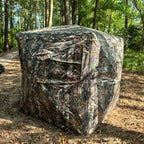 360° One-Way Camo Tent rear exterior with camouflage panels closed in a woodland clearing