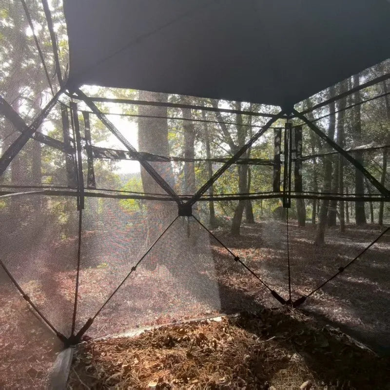 360° One-Way Camo Tent empty interior showing broad one-way mesh walls and the support frame