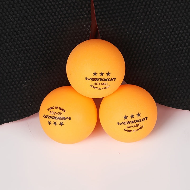3 orange ping pong balls