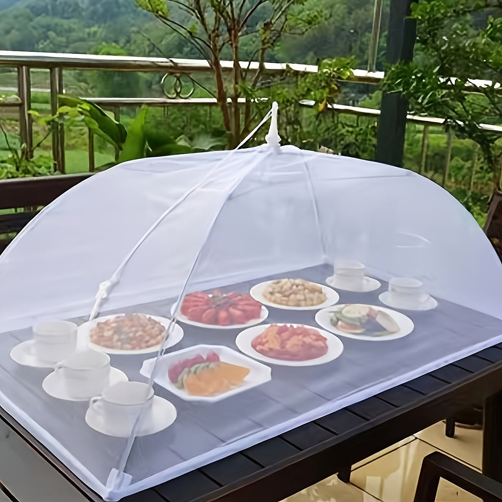 HighPeak Food Tent Cover in white mesh pop-up design protecting outdoor meal plates on a black table in garden setting