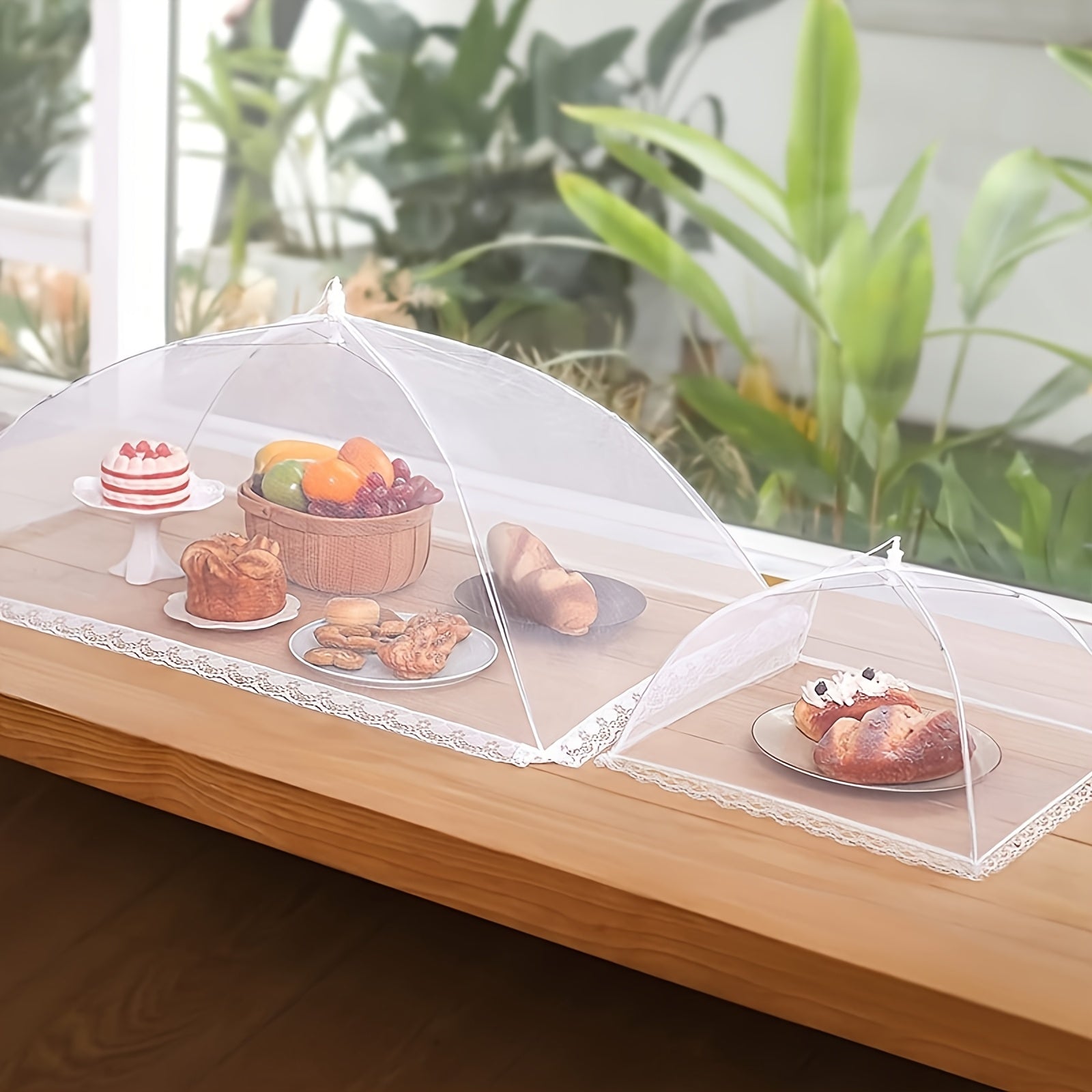 HighPeak Food Tent Cover in white mesh protecting cakes, bread, and fruit on wooden table outdoors