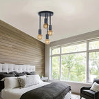 4-Light Ceiling Fixture in black installed above a modern bedroom with four exposed bulbs