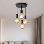 4-Light Ceiling Fixture in black shown close up above a modern neutral living space