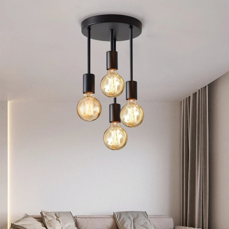 4-Light Ceiling Fixture in black shown close up above a modern neutral living space