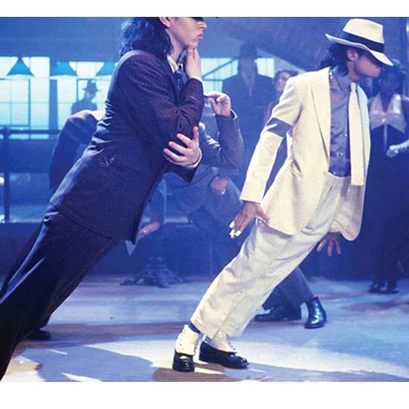 Supplier reference photo showing the forward lean effect with performers in suits