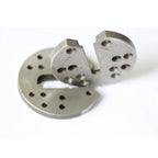 Two silver metal body tilt gimmick components with open slots and mounting holes, shown at an angle