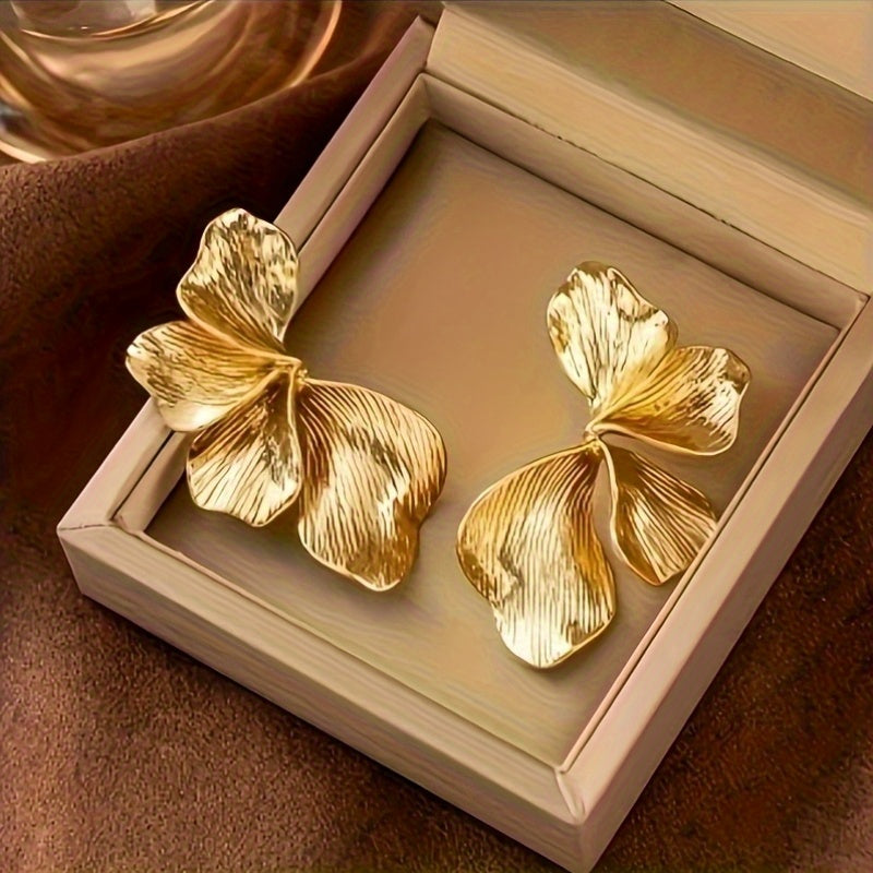 HighPeak Exaggerated Petal Earrings in textured gold copper with bold, sculptural petals in a gift box display