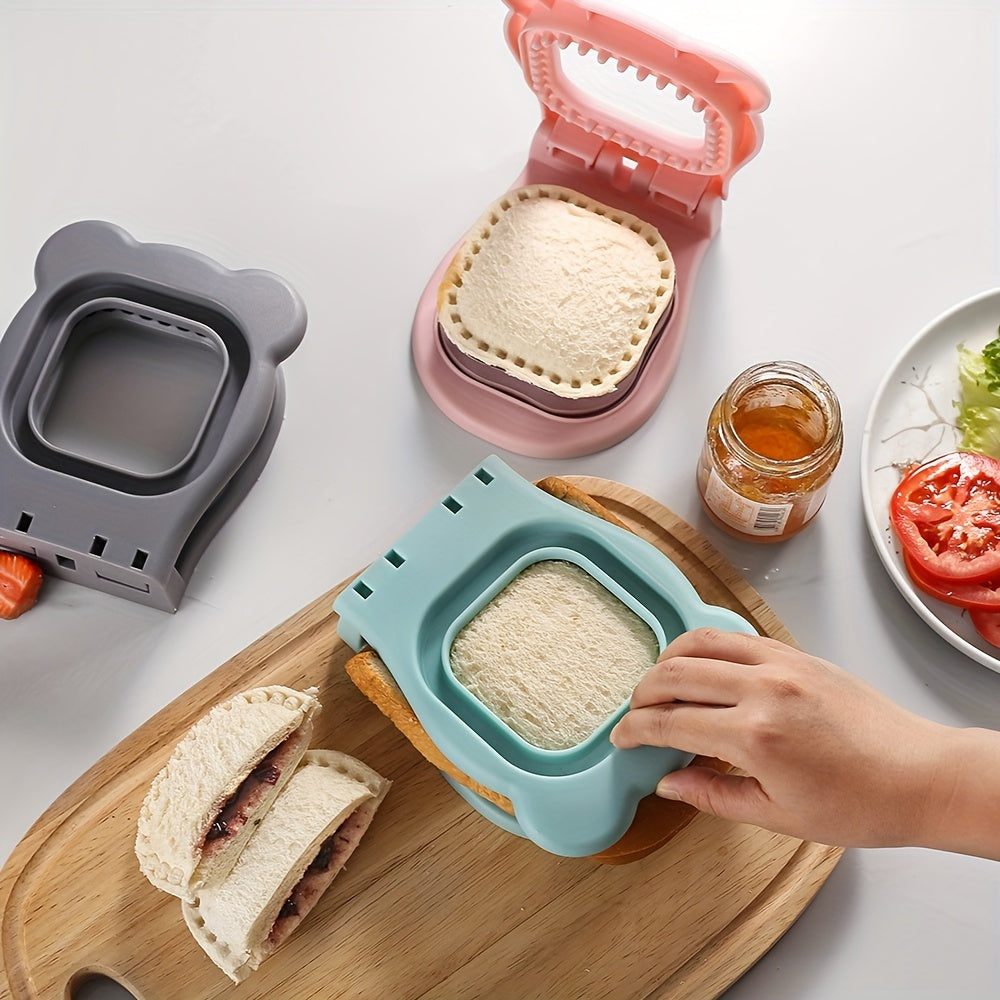 HighPeak SnackSeal™ DIY Sandwich Cutter in pastel colors sealing crust-free sandwich pockets on a wooden board