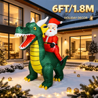 6FT Santa Dragon Inflatable displayed in a modern courtyard at dusk, showing the green dragon and Santa rider.