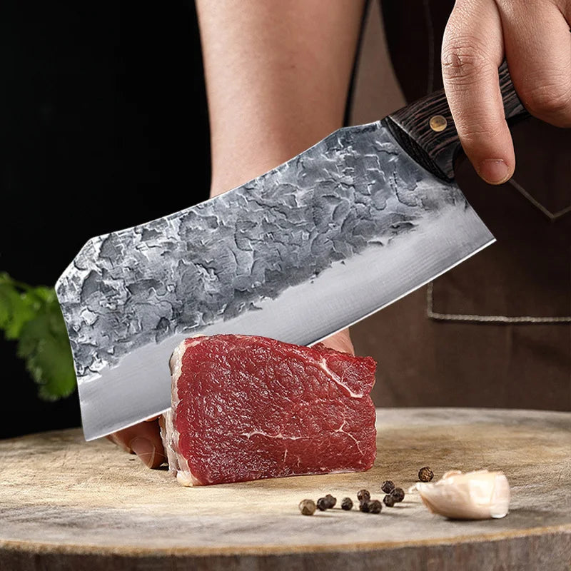 7-Inch Cleaver Chef Knife held above a boneless cut of beef on a wooden chopping board.