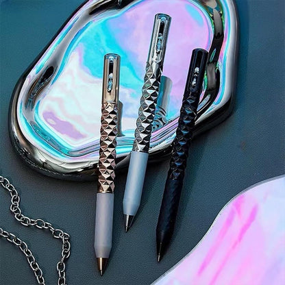 Geometric Metal Crinkle Pen with textured diamond pattern design in silver, black, and rose gold on iridescent surface
