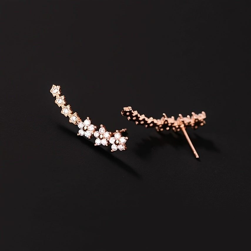 HighPeak Ear Climber Earrings in rose gold with sparkling rhinestones on black background, elegant curved design
