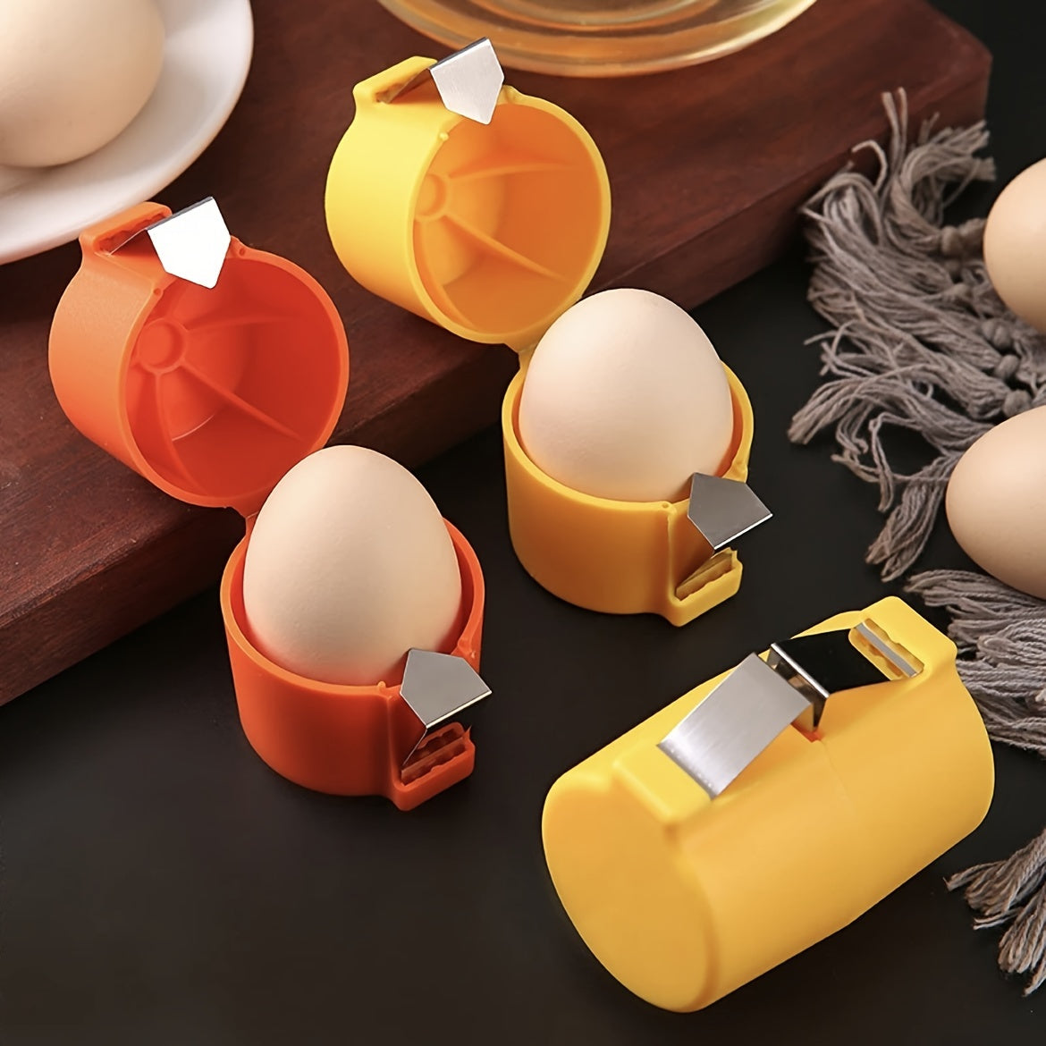 CrackMate™ eggshell separator in orange and yellow with eggs inside, showcasing clean, mess-free shell cracking by HighPeak