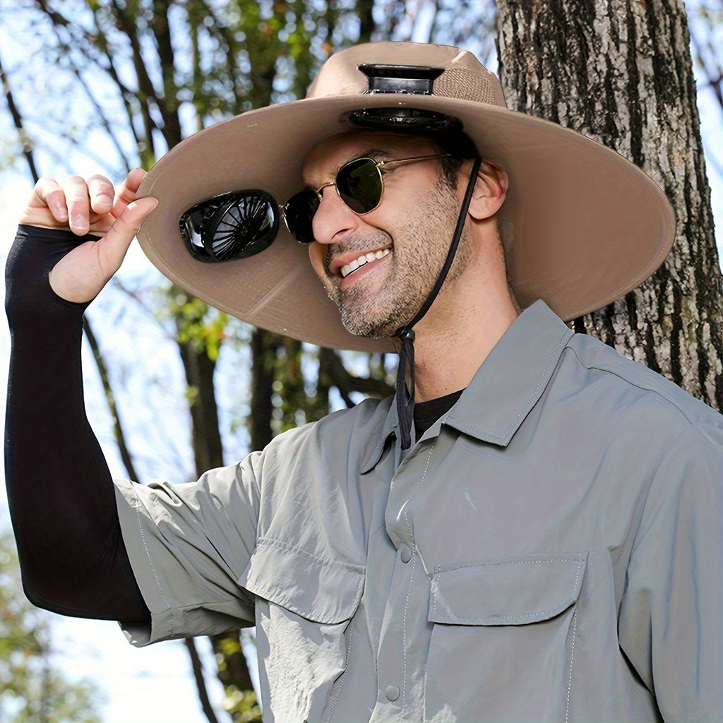 HighPeak Cooling Fan Sun Hat in tan with dual fans worn outdoors by man beside tree on sunny day