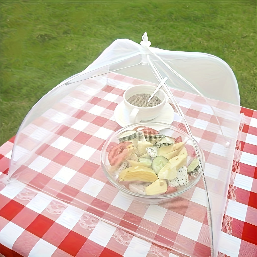 HighPeak Food Tent Cover in white mesh over fruit bowl and cup on red checkered picnic table outdoors