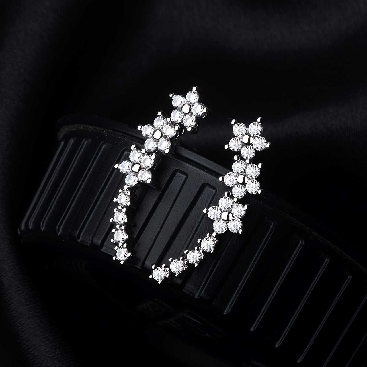 HighPeak Ear Climber Earrings with sparkling rhinestones on black background showcasing elegant curved design