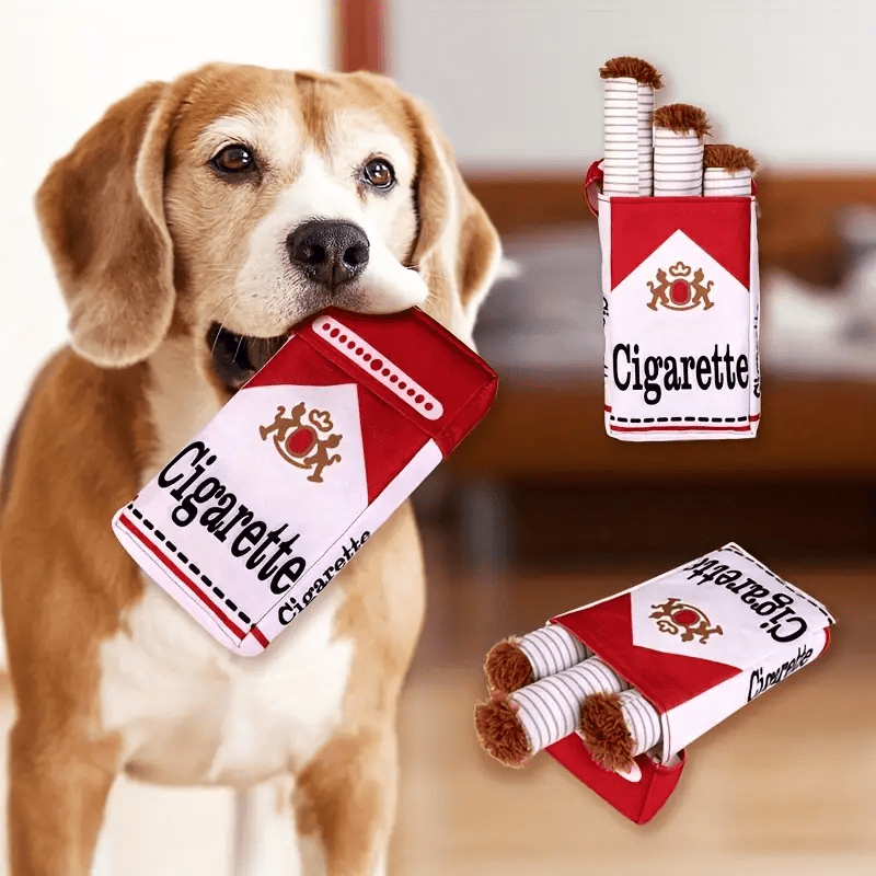 A beagle holding HighPeak HoundSmokes plush toy pack, with additional red and white cigarette-shaped chew toys displayed