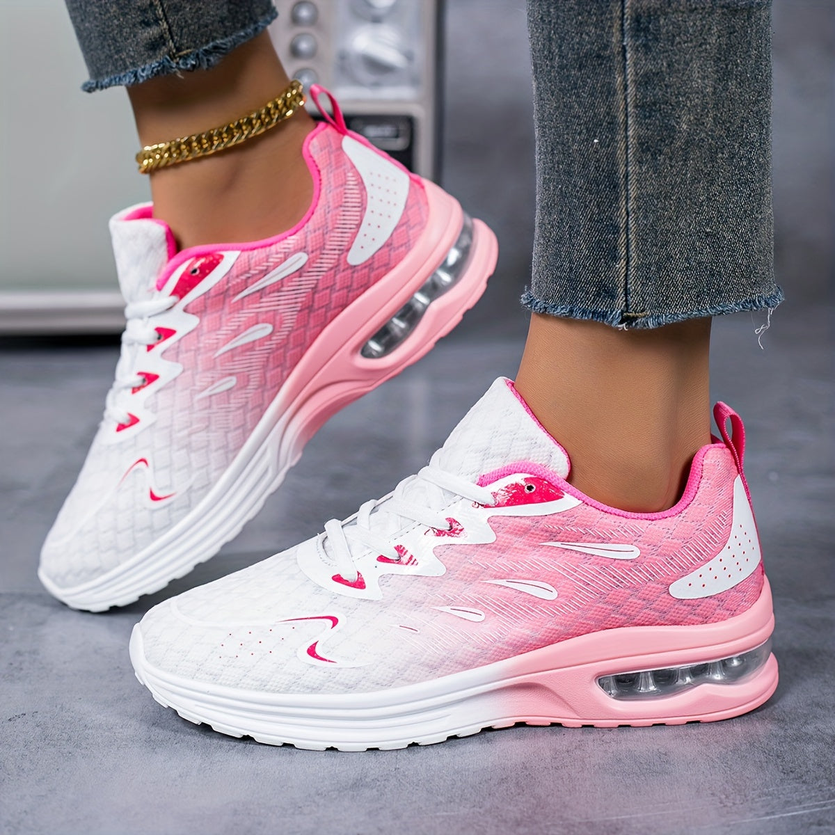 Air-Cushion Gradient Sneakers shown in pink and white ombre design with breathable mesh upper and cushioned sole, styled with jeans