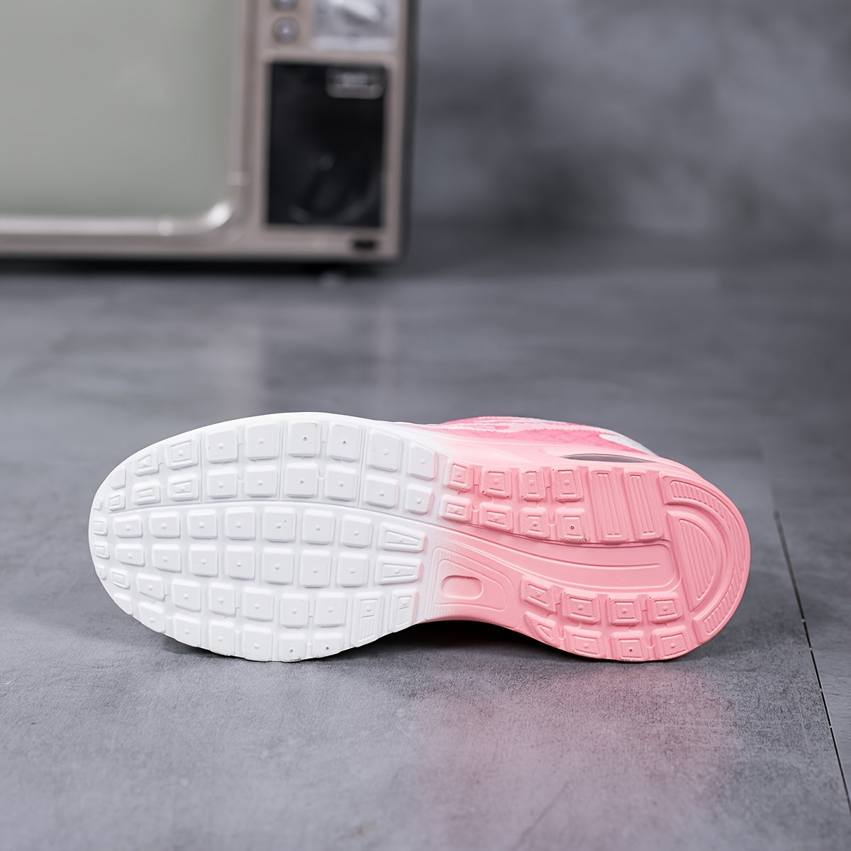 Air-Cushion Gradient Sneakers with pink to white ombre sole, textured grid pattern bottom, displayed on gray surface