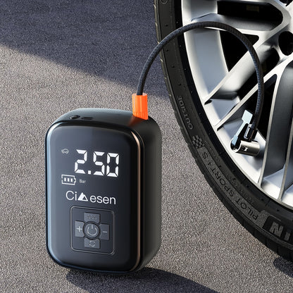AirBolt Mini smart tire inflator with digital display connected to car tire - compact black device showing PSI reading