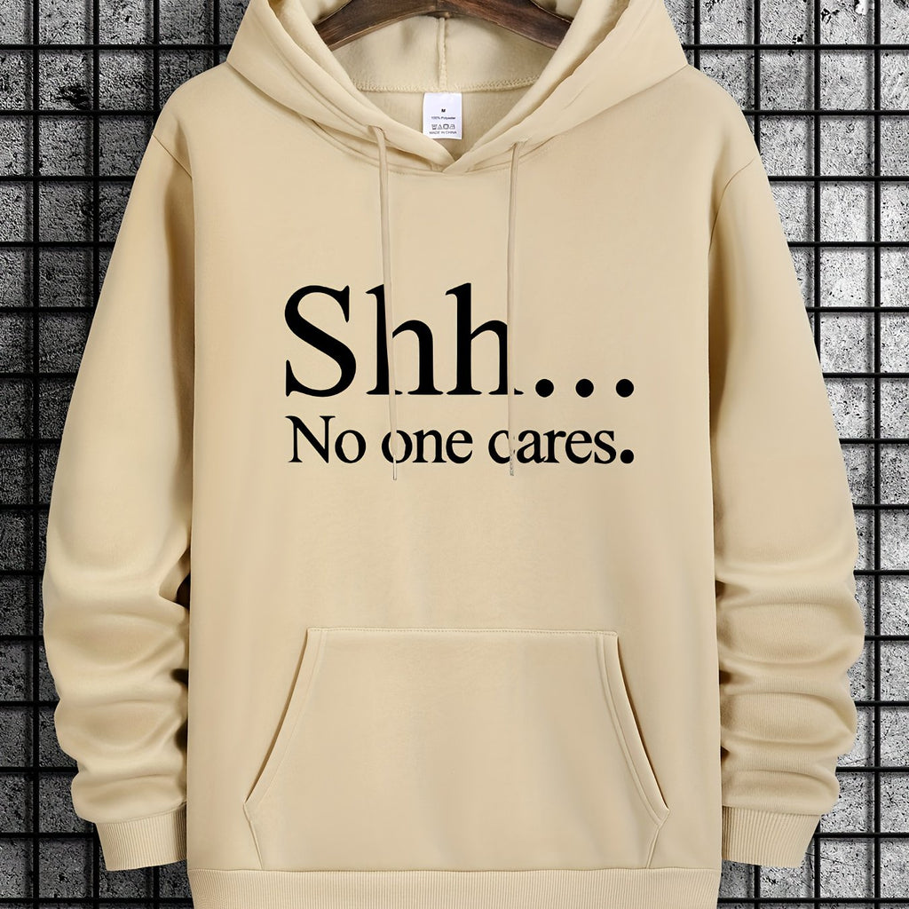 Beige pullover hoodie with "Shh... No One Cares" text design, featuring front kangaroo pocket and classic fit styling