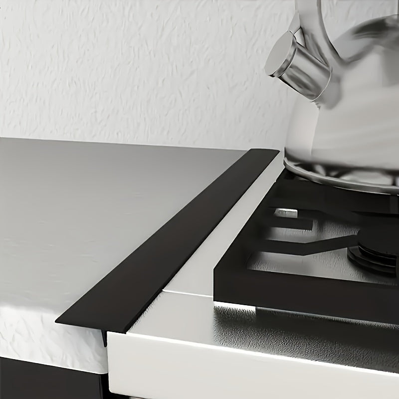 Black Kitchen Gap Guard installed between white counter and stove - seamless silicone gap cover for spill protection