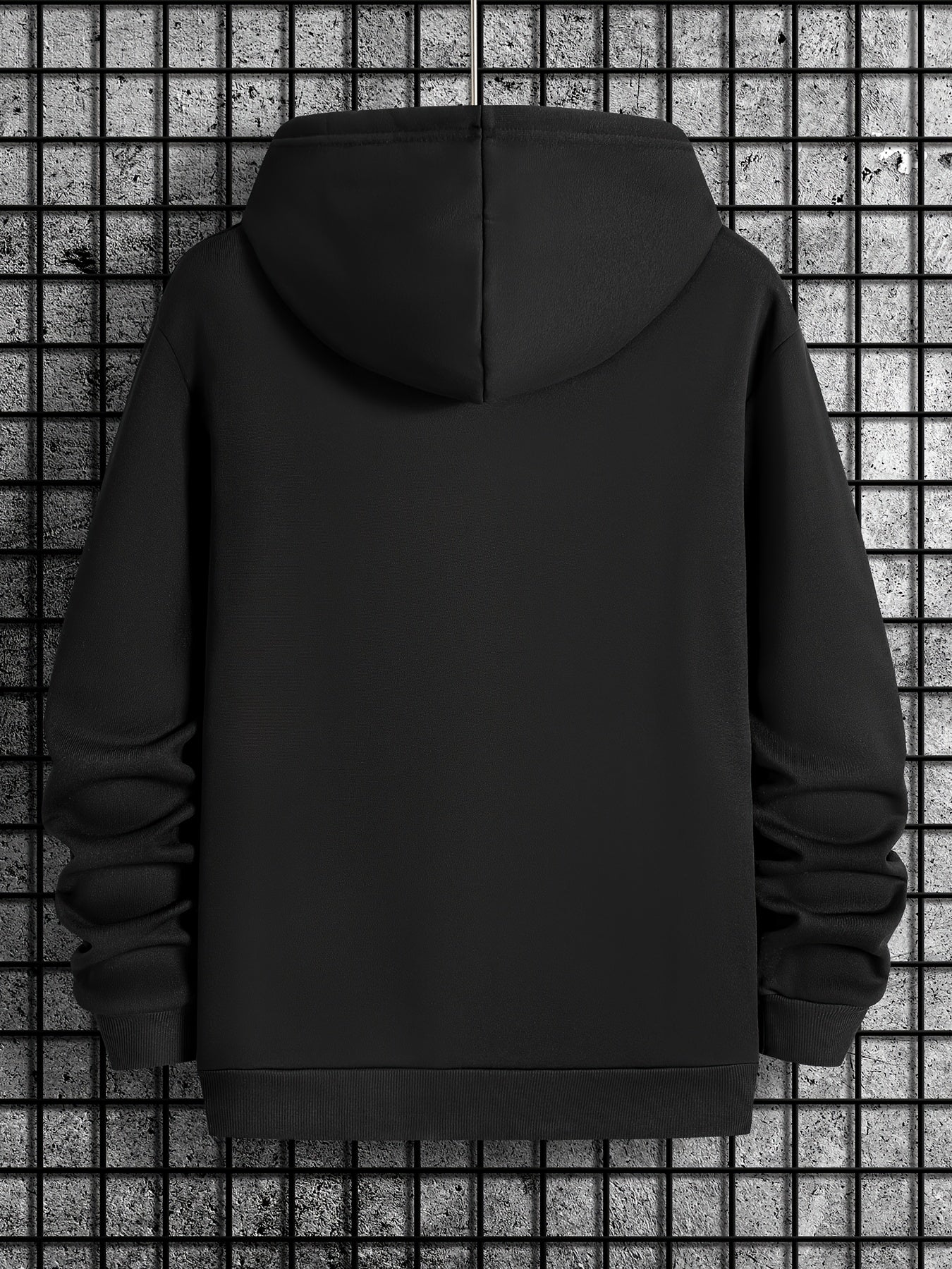 Black SHH No One Cares hoodie shown from back view displaying classic pullover design with hood against industrial grid background